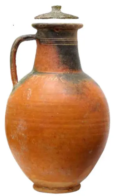 Funeral urn in the shape of a red varnish jug