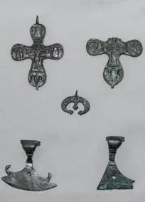 A collection of jewelry, crosses, moon pendants, amulets in the form of axes