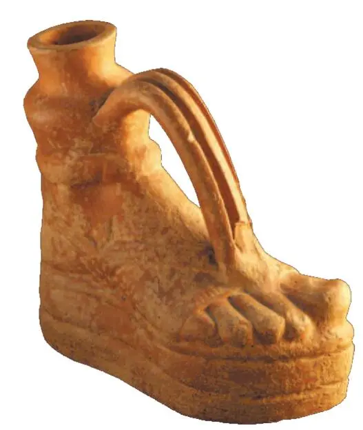 Figurative vessel in the form of a leg dressed in a cothurn