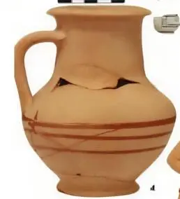 Ornamented red clay jug