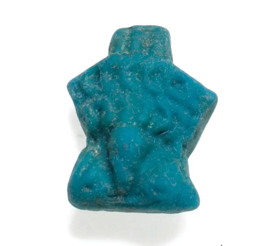 Egyptian faience pendant in the form of male genitalia